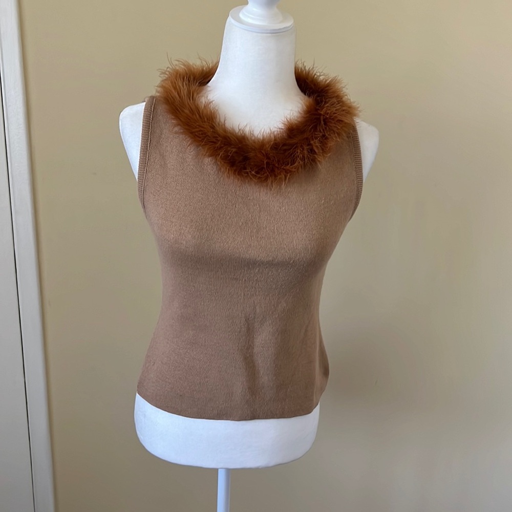 Tan colored sleeveless sweater top with feather collar